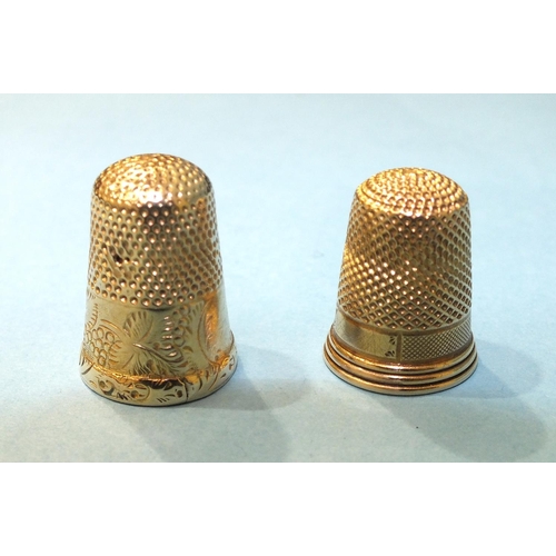 315 - Two yellow metal thimbles, sizes 6 and 7, (2).