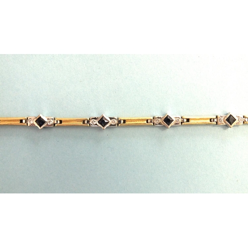 323 - An 18ct gold bracelet of eight white gold links, each set a square-cut sapphire between two brillian... 