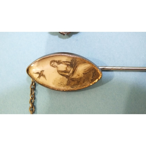 334 - A Georgian memorial silver stick pin, the navette-shaped ivory panel painted to depict a young woman... 