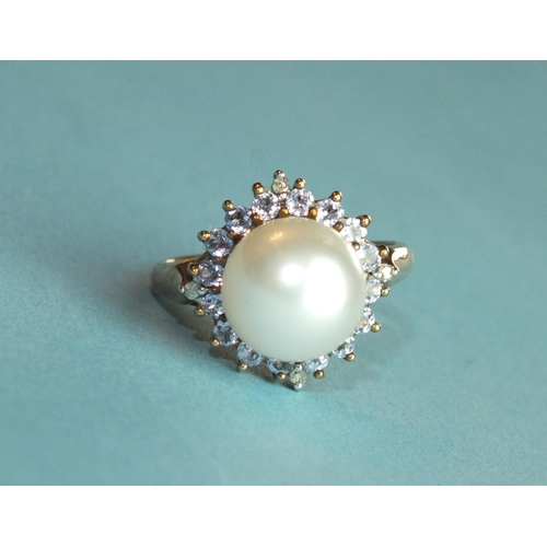 335 - A 9ct gold tanzanite and pearl cluster ring, with diamond point-set shoulders, size N, 4.3g.