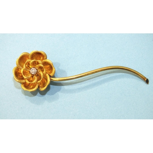 336 - An unusual flower brooch of two concentric rows of textured petals, around a claw-set diamond, on lo... 