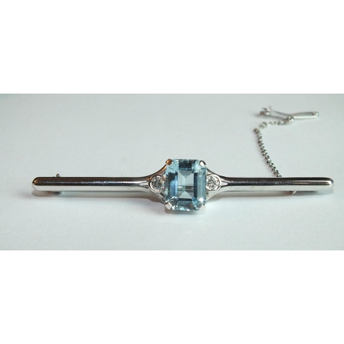 339 - A modern aquamarine and diamond bar brooch claw-set a step-cut aquamarine of approximately 2.7cts, b... 