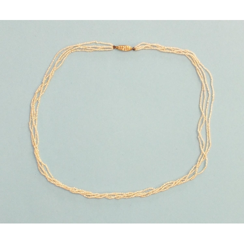 348 - A four-row seed pearl necklace, with pearl-set barrel clasp, 44cm long, 6.2g.