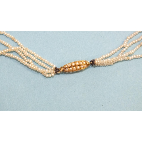 348 - A four-row seed pearl necklace, with pearl-set barrel clasp, 44cm long, 6.2g.