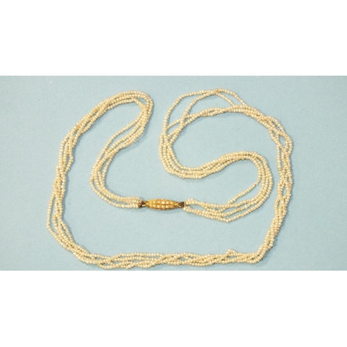 348 - A four-row seed pearl necklace, with pearl-set barrel clasp, 44cm long, 6.2g.