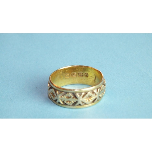 366 - An 18ct yellow gold wedding band with deeply-incised geometric decoration, size N, 4.5g.