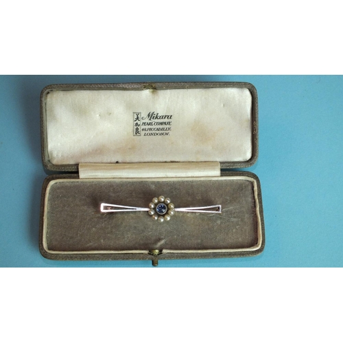 368 - An Edwardian 15ct white and yellow gold bar brooch millegrain set a round cut sapphire within a circ... 