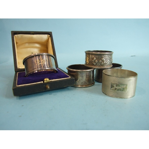 63 - Five various silver napkin rings, one boxed, ___3.15oz.