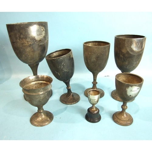 67 - A collection of seven plain engraved trophy cups, various sized, dates and makers, total weight ___3... 