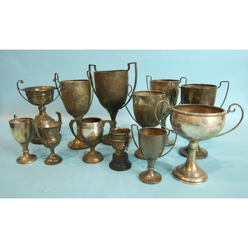 68 - A collection of twelve two-handled trophy cups, various sizes, dates and makers, total weight ___23o... 