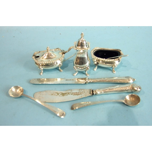 76 - Two Georgian mustard spoons and a three-piece condiment set, Sheffield 1965.