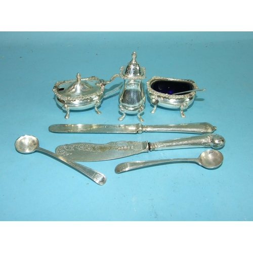 76 - Two Georgian mustard spoons and a three-piece condiment set, Sheffield 1965.