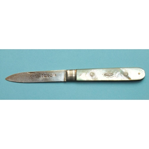 87 - A small silver-bladed fruit knife, the mother-of-pearl handle with etched decoration and inset small... 