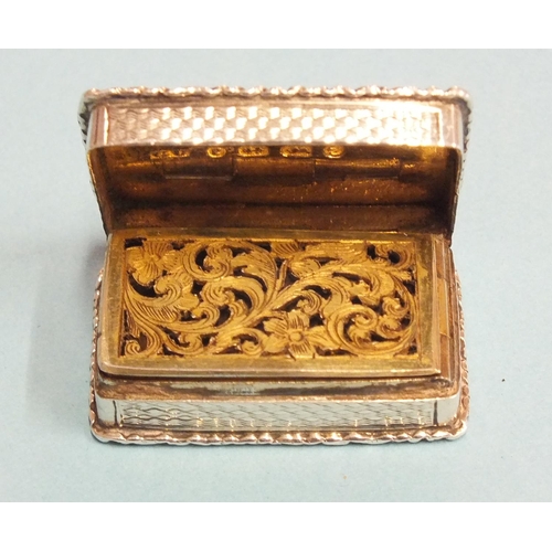 92 - A Victorian silver rectangular vinaigrette by George Unite, the scroll-moulded rim around an engine-... 