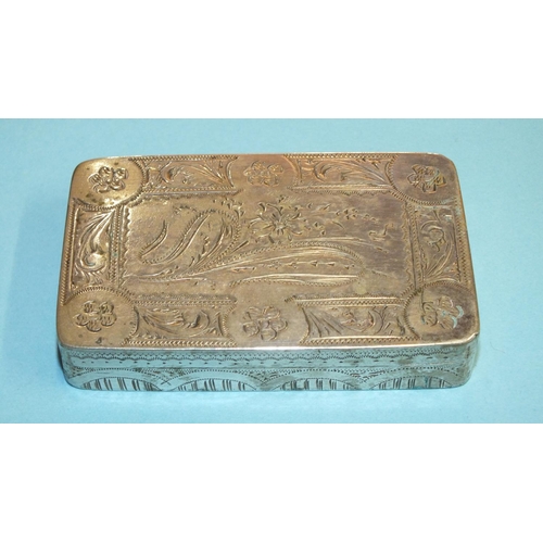 93 - A white metal rectangular snuff box with engraved floral and scroll decoration, unmarked, 7.5 x 4.8c... 