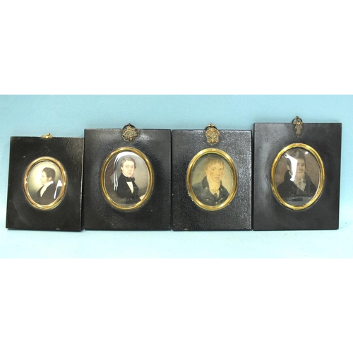 566 - Two 19th century miniature portraits of young men, painted on ivory, each within oval gilt metal bez... 