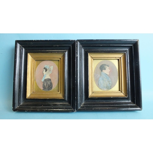 568 - A pair of 19th century miniature portraits, a lady and gentleman, 8 x 6.2cm oval, in gilt and black-... 