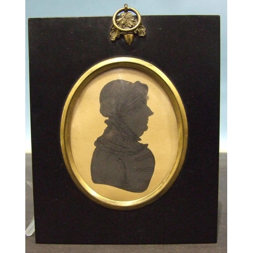 609 - J H Gillespie (attrib.), an early-19th century painted silhouette portrait of a middle-aged woman, w... 