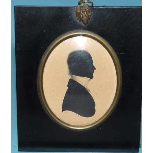 610 - John Field, an oval painted silhouette of a gentleman wearing a white stock, signed Field, 2 Strand,... 