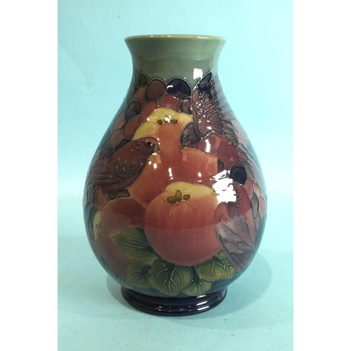 769 - A modern (seconds) Moorcroft baluster pottery vase in the Finches & Fruit pattern, underglaze painte... 