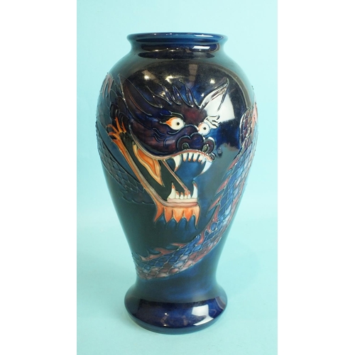 770 - A modern Moorcroft ovular-shaped vase decorated with a dragon on blue ground, 25.5cm high, factory m... 