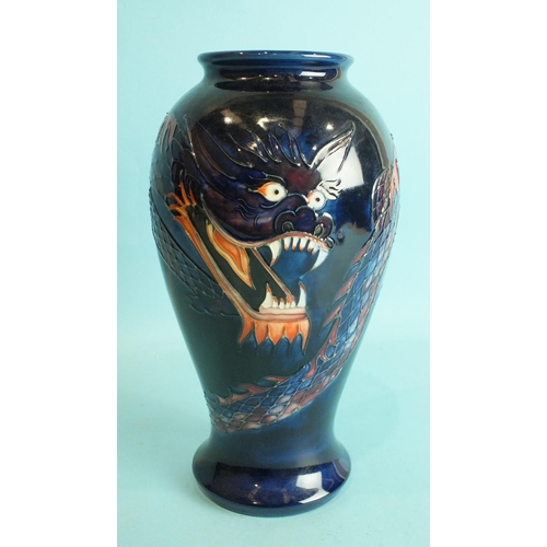 770 - A modern Moorcroft ovular-shaped vase decorated with a dragon on blue ground, 25.5cm high, factory m... 