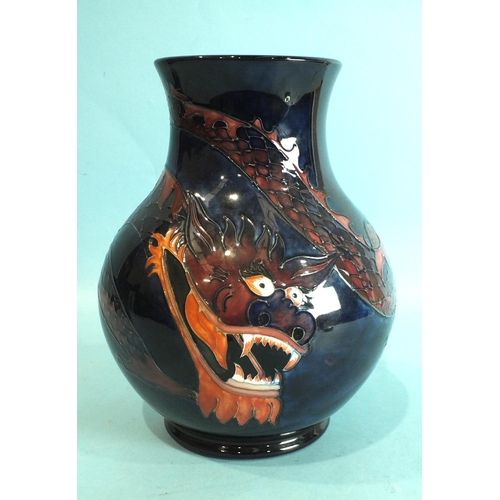 771 - A modern Moorcroft baluster-shaped vase decorated with a dragon on a blue ground, 24.5cm high, facto... 