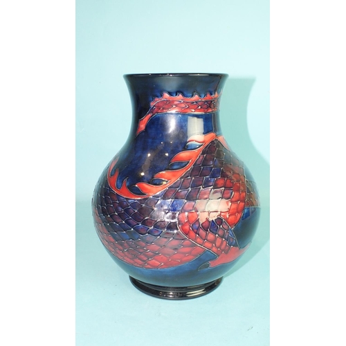 771 - A modern Moorcroft baluster-shaped vase decorated with a dragon on a blue ground, 24.5cm high, facto... 