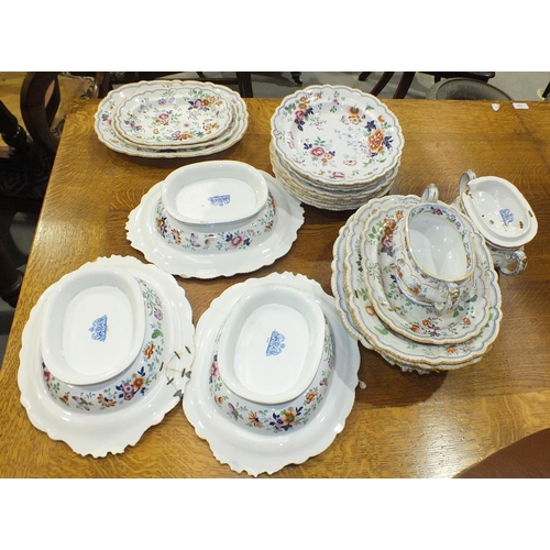 775 - A mid-19th century stone china dinner service decorated with sprays of flowers and butterflies, comp... 