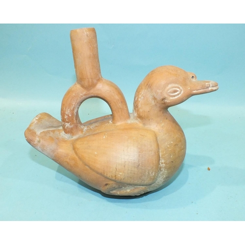 780 - An antique Peruvian or Inca terracotta drinking vessel in the form of a duck, with some original pai... 