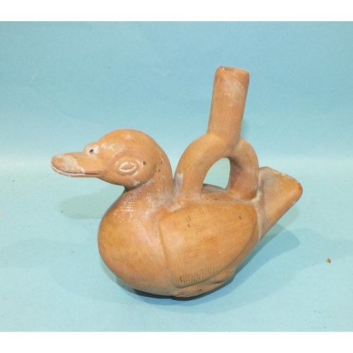 780 - An antique Peruvian or Inca terracotta drinking vessel in the form of a duck, with some original pai... 