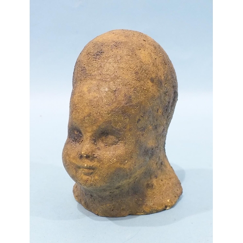 782 - A 20th century matt-glazed pottery sculpture of a child's head, 11.5cm high, impressed figural mark.