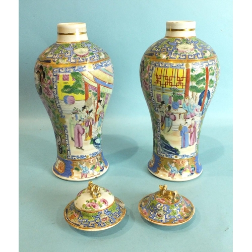 802 - A pair of mid-18th century Chinese Canton style vases decorated with court scenes and butterfly bord... 