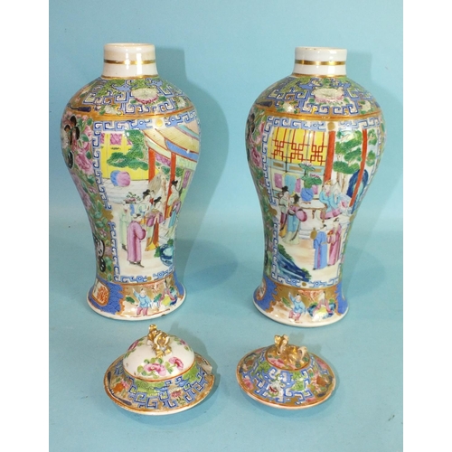 802 - A pair of mid-18th century Chinese Canton style vases decorated with court scenes and butterfly bord... 