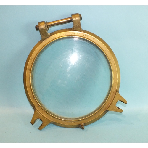 808 - A bronze glazed porthole cover, 41cm.