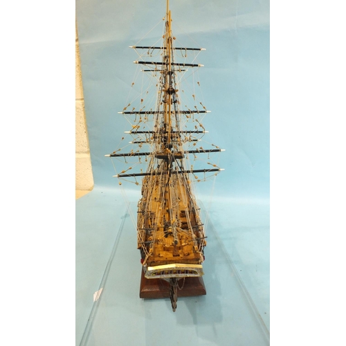 817 - A detailed model of HMS Bounty, with full deck details and rigging, on stand, in Perspex case, 52cm ... 