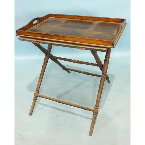 818 - A 19th century oak butler's tray and stand, the tray 70 x 49cm.