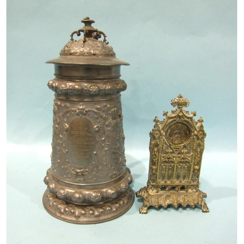 824 - A Continental bronze or brass watch holder of architectural form, cast with arches and caryatid pill... 