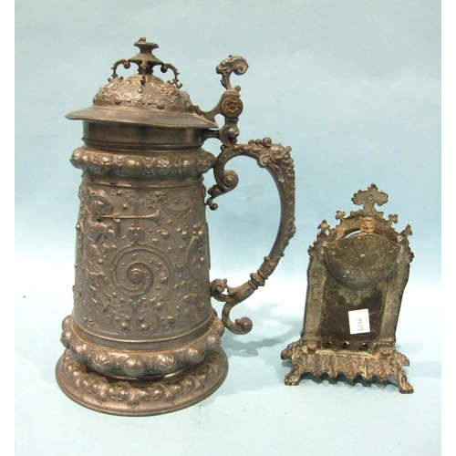 824 - A Continental bronze or brass watch holder of architectural form, cast with arches and caryatid pill... 