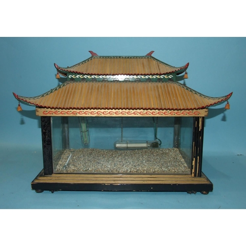 825 - An early-20th century Japanese terrarium of rectangular form with glazed sides, on wooden stepped ba... 