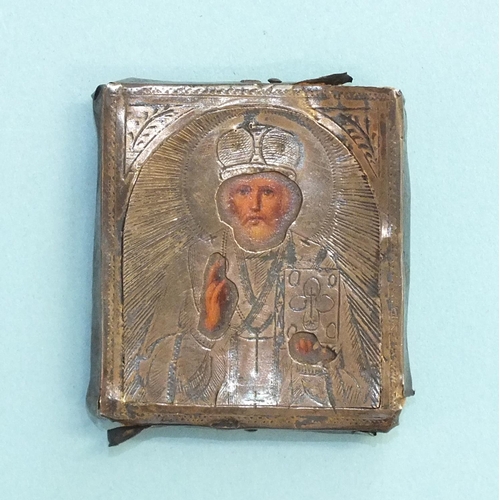 842 - A 19th century Russian icon, the silver mounted depiction of St Nicholas with painted face and hands... 