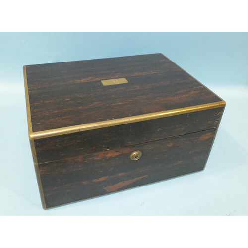 845 - A W. Leuchars, London coromandel wood brass bound dressing case of rectangular shape with J Bramah l... 