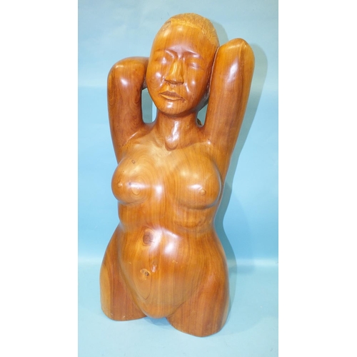 864 - Arthur Morris, a carved wood three-quarter length figure of a nude woman, her hands clasped behind h... 