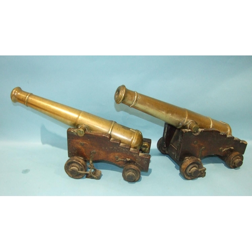 870 - An unusual pair of bronze signalling canons, each 55cm barrel with Victorian cipher, supported by a ... 