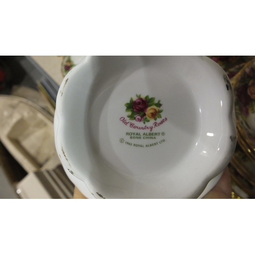 117 - Approximately fifty-four pieces of Royal Albert Old Country Roses tea and dinnerware.