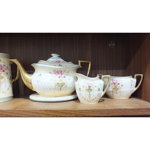 118 - A set of three Fieldings Crown Devon Dora decorated graduated jugs and a three-piece tea service wit... 