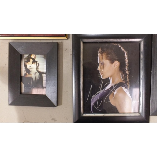 150 - An autographed photograph, Tomb Raider by Angelina Jolie, 19.5 x 24.5cm with COA, a Tomb Raider seri... 