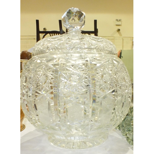 158 - A large round cut-glass punch bowl with lid, 23cm diameter, 31cm high, an oval cut-glass biscuit bar... 