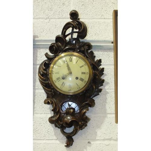 159 - A 20th century stained wood cartel clock carved in the rococo style, the movement striking on a bell... 