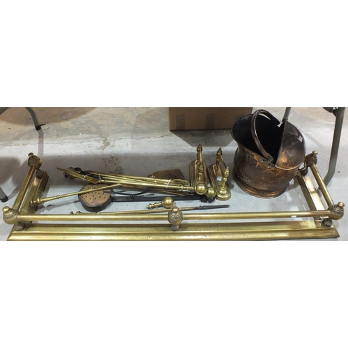 170 - A brass fire kerb with tubular rail, 135cm, two pairs of three fire brasses (af), a pair of brass fi... 